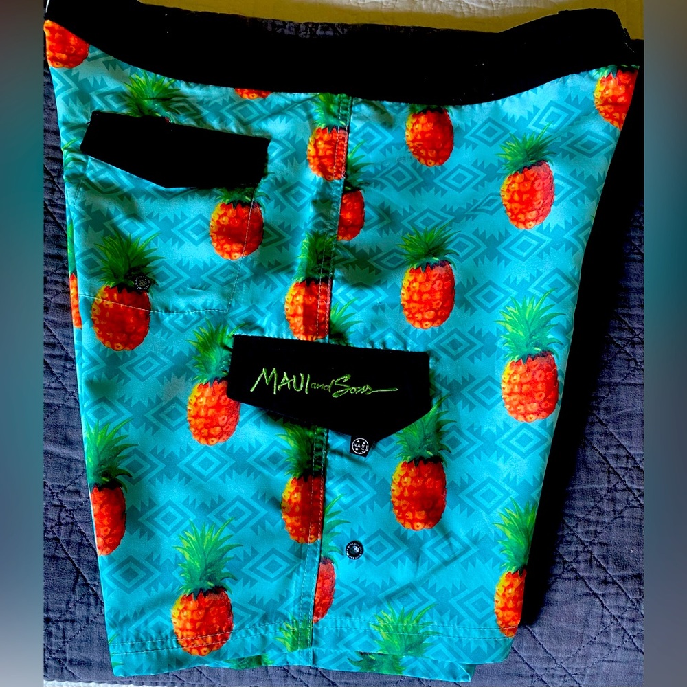 Blue Pineapple Maui & Sons board shorts.